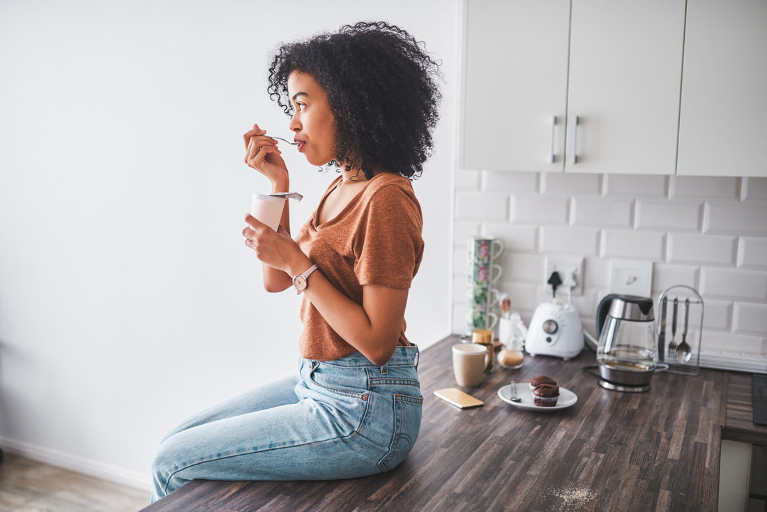 Woman eating probiotic-rich yogurt