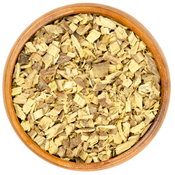 Dried licorice root in a wooden bowl