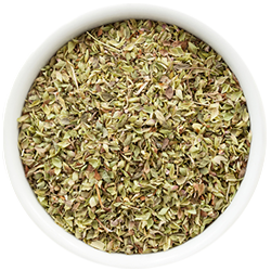 Dried oregano in a white bowl on a white background