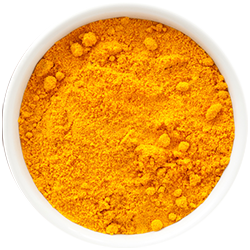 Vibrant orange turmeric in a wooden bowl on a white background