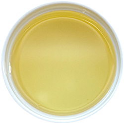Wild Alaskan Salmon oil in a white bowl on a white background