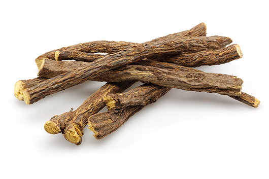 Raw dried licorice root on a white background