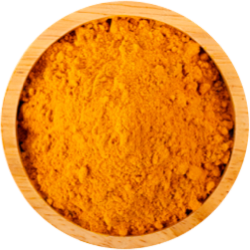 Vibrant orange turmeric in a wooden bowl on a white background